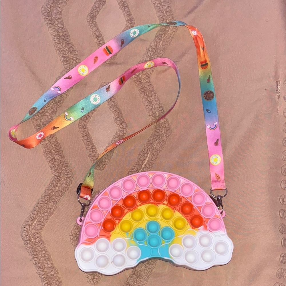 Child’s vibrant pop it rainbow purse.